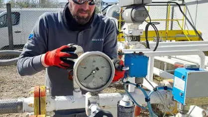 Photo of a man doing preventative maintenance